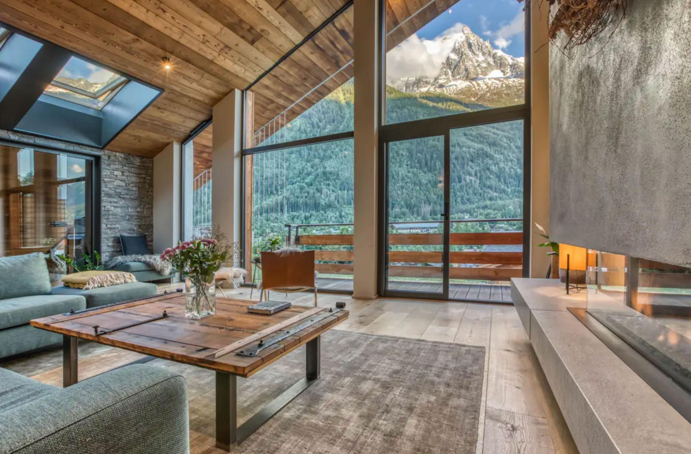 hot tub on a wooden deck overlooking mountain scene
